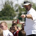 Springdale High football coach Kevin Johnson talks to players during a preseason practice on Aug. 4,...
