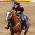 Kynder Starr races through the finish of the barrel racing event during the slack competition at the...