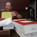 Circuit Judge David Clinger works Wednesday on a judgment in a civil case at his office in the Bento...
