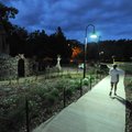 A jogger runs early this week under new lights on the Wilson Park Trail in Fayetteville. The city Pa...