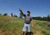Randy Porter of Cincinnati points out a swath of destruction left by a New Year's Eve tornado.

