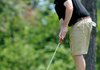 Connor McNair sinks a putt on green number six in the Fayetteville Country Club Match Play Tournament in Fayetteville on Sunday. The final rounds are today.