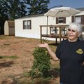 Wanda Tiger gestures as she talks outside her FEMA trailer home in Little Axe, Okla., Thursday, June...