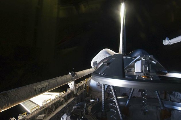 this-sunday-july-10-2011-photo-provided-by-nasa-shows-the-docking-mechanism-in-space-shuttle-atlantis-payload-bay-shortly-before-the-shuttle-docked-with-the-international-space-station