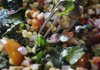 This zesty Salsa Salad features corn, tomatoes, onions and Malabar spinach from an area farmers market.
