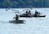 The Benton County Dive Team, U.S. Corps of Engineers and firefighters search an area of Beaver Lake near the Ventris boat launch for a college student who went missing from a boat early Saturday afternoon. Photograph Beaver Lake, Ark. Saturday, July 16, 2011. The missing man had been boating with fellow students from Kansas.
