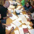Volunteers from the Benonville School District write thank you notes Thursday, July 14, 2011, at Jop...