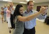 Kevin and Heather Yingst of Bella Vista dance Wednesday, July 13, 2011, during a ballroom dance class at the Lifelong Learning Center of Northwest Arkansas in Bentonville. The for-profit business subcontracts teachers for lessons in things such as firearm basics, intro to bass fishing and ballroom dancing.
