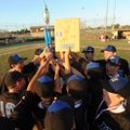 Harrison players celebrate with their trophy after winning the 14-year-old Babe Ruth state North cha...