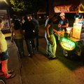 Patrons line up to purchase items Friday from Yancey’s Hot Dogs in Fayetteville.