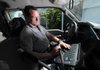 John Hart, Fayetteville animal control officer, checks calls for service Friday July 22, 2011. He says getting calls about dogs left in cars are common but the car is usually gone by the time he arrives.

