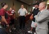Wayne Stehlik, right, talks to coaches from the Springdale school district at a news conference Tuesday to officially announce Stehlik’s hiring as Springdale athletic director.