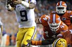  LSU quarterback Jordan Jefferson (9) runs past the Florida's  Duke Lemmens (44) for a 1-yard touchdown during the first half of an NCAA college football game in Gainesville, Fla., Saturday, Oct. 9, 2010.