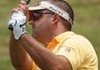 Jack Myers watches as his 92-yard wedge shot lands within an inch of hole 17 during the Bella Vista Men’s Club Championship at the Bella Vista Country Club in Bella Vista on Sunday. Myers would go on to win the championship on the second hole of a playoff against Mark Chambers.