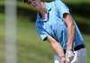 Bentonville’s Brik Brauburger, 17, pitches onto the No. 3 green on Tuesday during the ASGA Pinnacle Country Club Junior Stroke Tournament in Rogers.