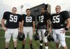 Bentonville’s Justin Fair, left, Cody Sander, Savoy Santiago and Jared Conover will anchor the Tigers’ defensive line this season.