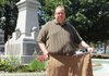  Alan Simmons holds a pair of pants on, Tuesday, July 19, 2011, he wore before loosing more than 100 pounds in preparation for laproscopic banding surgery that was scheduled for the next day.
