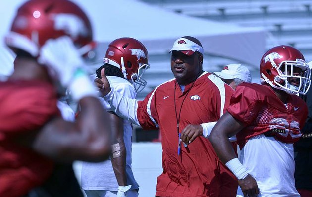 university-of-arkansas-assistant-coach-reggie-johnson-works-with-the-team-during-practice-monday-afternoon-at-razorback-stadium-in-fayetteville
