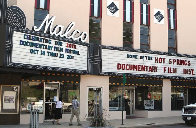 pedestrians-stroll-past-the-malco-theater-in-hot-springs-home-of-the-hot-springs-documentary-film-festival