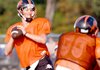 Clayton Alexander drops back to pass during the Gravette Lions' scrimmage on Saturday.