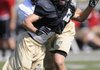  Bentonville linebacker Chris Scroggins gets around an offensive lineman during practice Thursday, Aug. 18, 2011, at Tiger Stadium in Bentonville.
