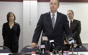  
Scott Ellington, center, prosecuting attorney second judicial district, flanked by prosecutors Melonie Osworth and Alan Copelin, discussed the terms of a deal struck by the state releasing three men convicted of the 1993 deaths of three West Memphis children.  Damien Echols, Jessie Misskelley and Jason Baldwin agreed to a legal maneuver that lets them maintain their innocence while acknowledging prosecutors have enough evidence against them.