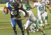   North Little Rock's Altee Tenpenny escapes the grasp of a Van Buren' Jimmy Barber on a run for a touchdown in their game at North Little Rock Friday.