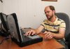  Derrick Wright, network technician for the city of Springdale, works on repairing a laptop Friday August 19, 2011 in Springdale. The Springdale information Technology department is moving to this new building adjacent to the Shiloh Square and will add a new employee.

