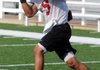 Springdale senior Henry Hernandez works through catching drills at practice on Wednesday at Jarrell Williams Stadium in Springdale.