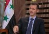 Syrian President Bashar Assad appears on a Syrian state television broadcast on Sunday. 
