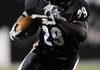  STAFF PHOTO MARC F. HENNING
Bentonville running back Tearris Wallace rushes for a first down during the Tigers' 7A State Playoff game Friday, Nov. 19, 2010, against Bryant at Tiger Stadium in Bentonville.