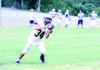 Dylan Toney, a senior running back, catches the
ball during a practice at Clinton High School.