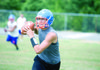  Senior Justin Lovell looks for a receiver during practice at Cedar Ridge High School. Lovell will lead the Timberwolves as the quarterback this season. 

