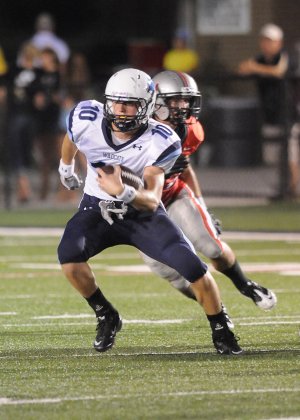 Har-BerÕs Evan Johnson runs a quarterback sneak against the Union Redskins in the Tulsa Gridiron Classic at Union High School in Tulsa, Okla. Friday, Aug. 26, 2011.
