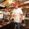 Ken Coffey of Prairie Grove, center, and Robby McGuire of Springdale, both members of the Ozark Catt...