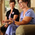 Dana Quinn of Bentonville, left, and Mary Katherine Wilson of Fayetteville speak Aug. 23 about their...