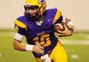 Little Rock Catholic quarterback Zach Conque runs for positive yardage during the first quarter of Thursday nights 7A football game against Springdale at War Memorial Stadium in Little Rock.