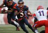 Arkansas Democrat-Gazette/RYAN MCGEENEY - 09-01-2011 - Rogers Heritage wide receiver Forrest Johnson rushes for yardage during the first half of Thursday's Kickoff Week game against Hillcrest at Razorback Stadium in Fayetteville.
