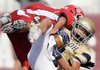 Shiloh Christian wide receiver Ryan Michaelis, right, hauls in a pass for a touchdown under pressure from Heber Springs' Brooks Morgan during the second quarter of the Saints' game Thurdsay, Sept. 1, 2011, against the Panthers in the 2011 Hooten's Kickoff at Reynolds Razorback Stadium in Fayetteville.

