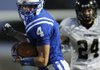 STAFF PHOTO MARC F. HENNING
Rogers defensive back Joe Adams returns an interception Friday, Sept. 2, 2011, during the second quarter of the Mounties' season opener against Neosho, Mo., at Mountie Stadium in Rogers.