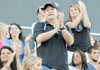 Lt. Col. Tim Williams watches his son play football Thursday at Tiger Stadium in Bentonville. Williams is home on leave from serving with the Army Reserves in Afghanistan. 