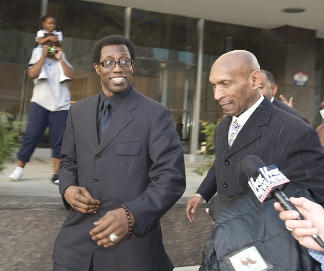 actor-wesley-snipes-left-talks-with-the-media-as-he-leaves-us-district-court-in-ocala-fla-with-a-member-of-his-defense-team-in-2008