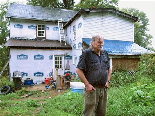 charles-richardson-jr-stands-in-the-rain-outside-a-rural-home-near-morgantown-wva-tuesday-sept-6-2011-richardsons-son-and-four-other-family-members-were-shot-to-death-at-this-house-on-monday-sept-5-2011