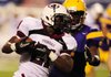 Springdale running back Rahmon Taylor sprints around the right end during the first quarter of Thursday night’s game against Little Rock Catholic at War Memorial Stadium in Little Rock.