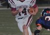 Siloam Springs quarterback Braden Pippin fights for yards in a win over Rogers Heritage. 