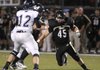 Bentonville's Josh Ford puts pressure on quarterback Drew Hare on Friday, Sept. 9, 2011, while hosting Ft. Zumwalt, Mo., at Tiger Stadium.