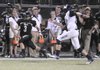 STAFF PHOTO J.S. WEDGEWORTH - Bentonville's Chris Mizelle runs down the sideline Friday, Sept. 9, 2011, after intercepting a pass while hosting Ft. Zumwalt, Mo., at Tiger Stadium.