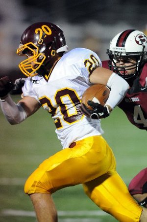 Staff Photo ANTHONY REYES - Springdale senior Andrew Armstrong (4) pursues Lake Hamilton senior Austin Essner (20) during the frist half Friday Sept. 9, 2011 at Jarrell Williams Bulldog Stadium in Springdale.