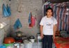 Xiang Zhanyong, 47, who works in a gold mine in Zhaoyuan, China, stands in the one-room brick structure provided to him for housing by the mine. 