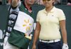Caddie Jason Hamilton of Australia gives Yani Tseng of Lake Nona, Fla., advice on her tee shot Friday before hitting on No. 1 during the first round of the LPGA Walmart NW Arkansas Championship presented by P&G at Pinnacle County Club in Rogers.